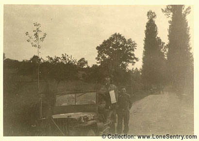 [U.S. Army jeeps on a road in France during WWII]