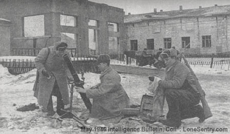 [Members of a battalion medium mortar company set up an M1941 82-mm mortar among the ruins of Kharkov.]